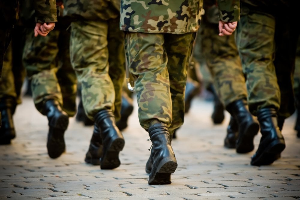 Why are soldiers often told not to march in unison over a bridge