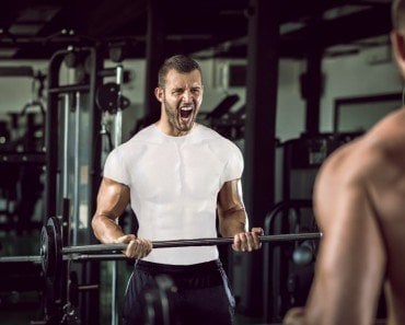 Man grunting in gym