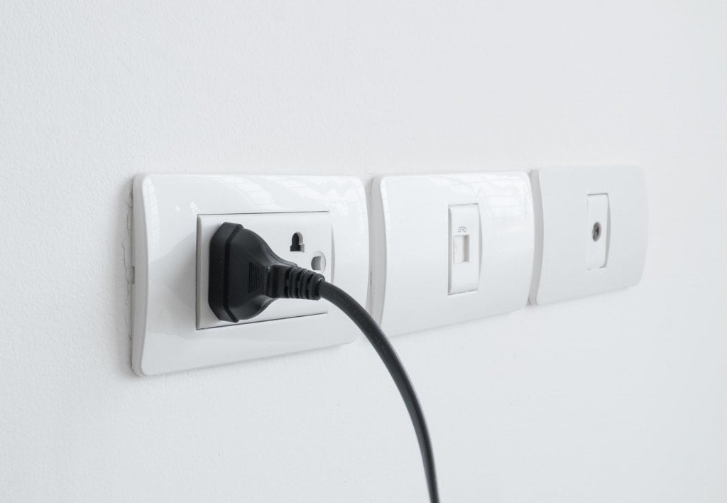 Plug plugged in a wall socket