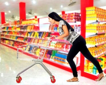 Woman pushing shopping cart trolly