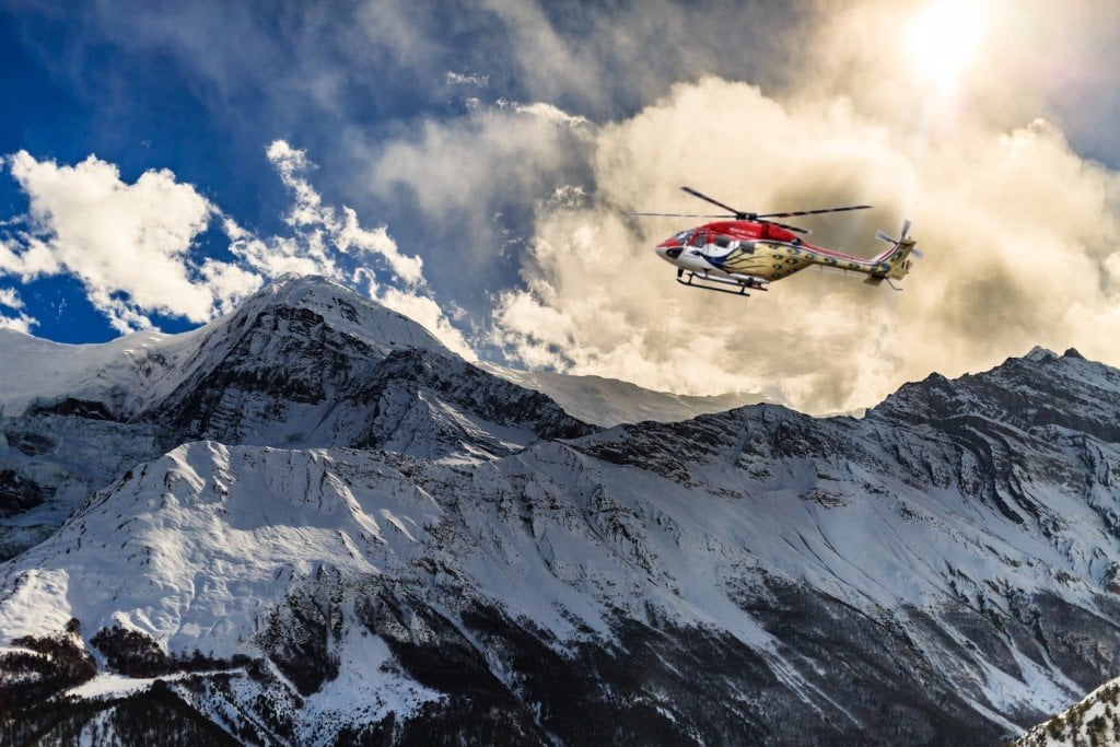 Helicopter landing on a mountain