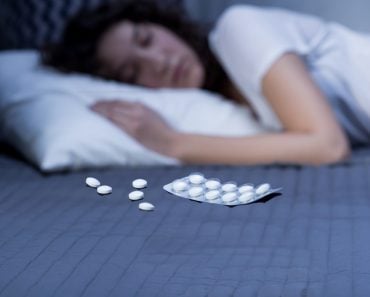 lady sleeping with sleeping pills