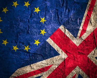 Image relative to politic relationships between Europe Union and United Kingdom. National flags on concrete textured backdrop. Brexit theme