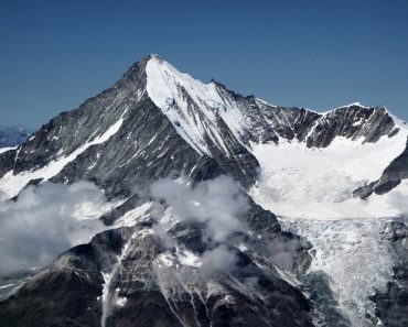 Majestic Weisshorn, a beautiful snow caped mountain peak in Switzerland