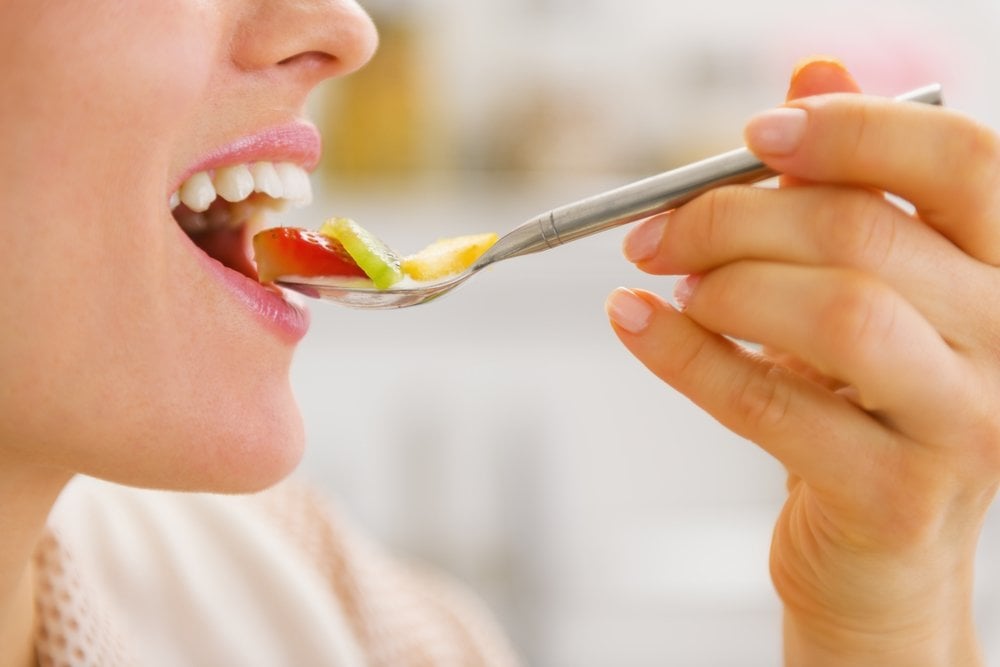 Closeup on woman testing fruits