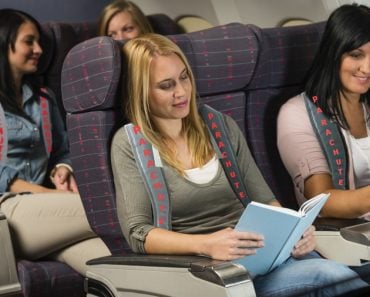 Parachute wearing airplane passenger