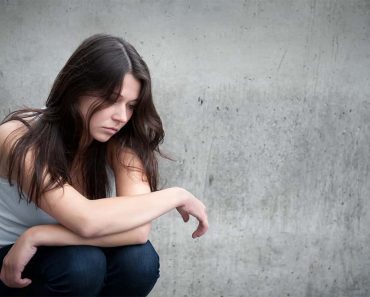 Sad teenage girl looking thoughtful