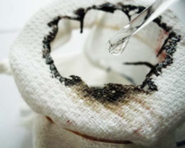 Drops of concentrated sulphuric acid (sulfuric acid) dehydrate a piece of cotton towel rapidly.