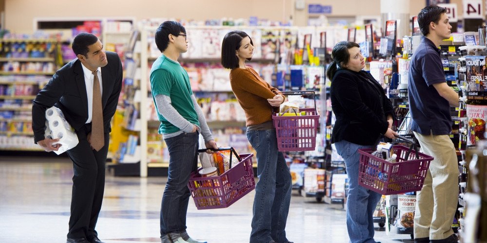 People in shopping mall queue for cashier counter