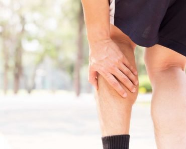 Cramp in leg while exercising. Sports injury concept