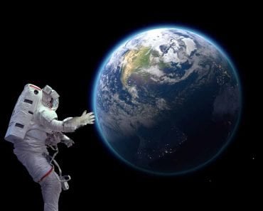Astronaut in space looking at earth