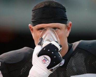 Athlete inhaling football player closeup