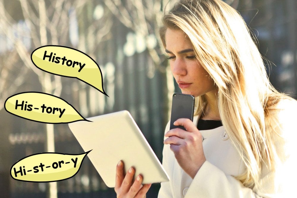 Confused girl reading history word in tablet