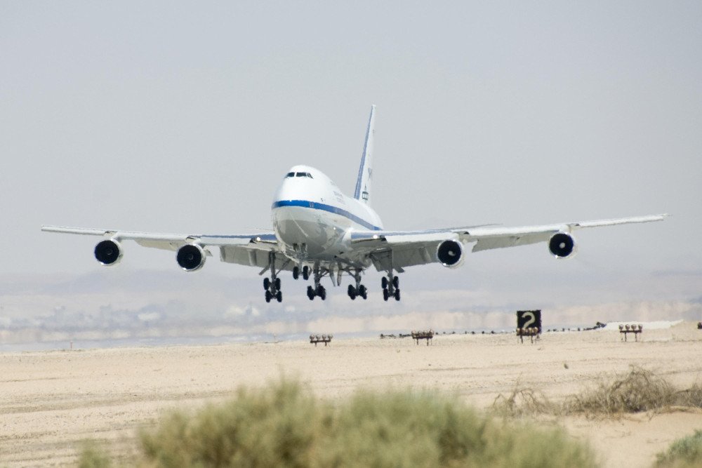 Airplane flying taking off in hot climate