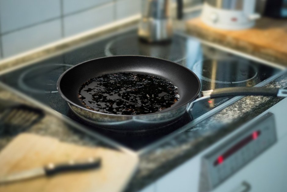 Burnt food in a pan in a kitchen