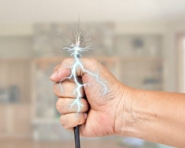 Shock live wire in human hand