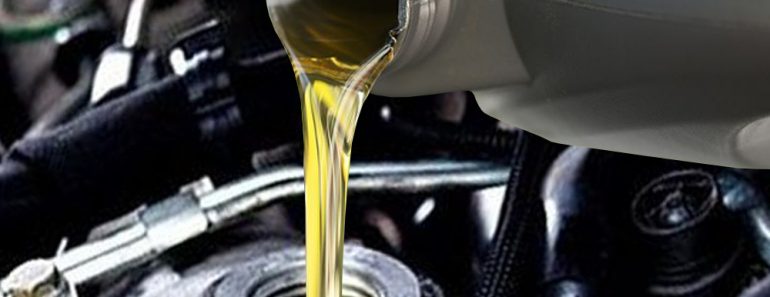 Pouring motor oil in engine