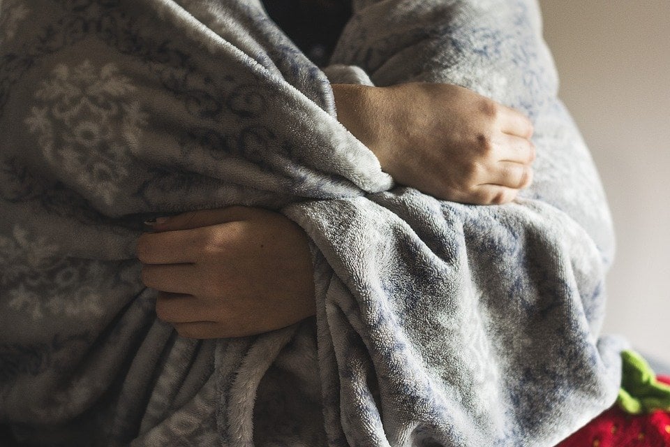 hands in blanket