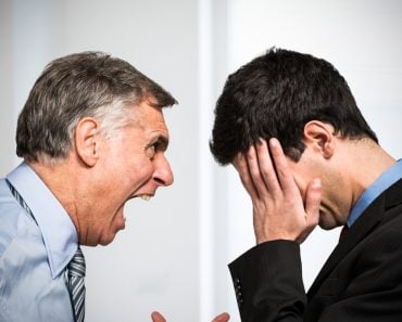 Angry boss shouting to an employee - Image( Minerva Studio)s