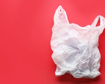 Clear disposable plastic bag on color background( New Africa)S