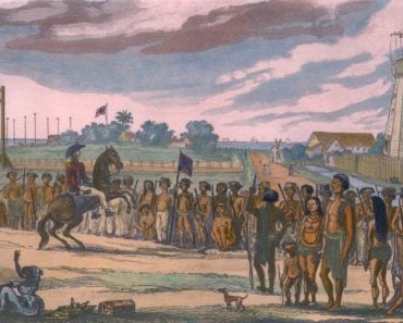 Natives of the colony of British Guiana are reviewed prior to their clean up operations( Everett Historical)s