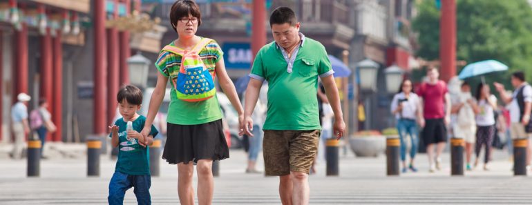 Chinese couple with child. China's one-child policy, initiated late 1970s(TonyV3112)s