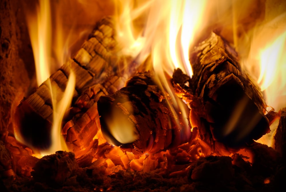 crest of flame on burning wood in fireplace(Sinelev)s