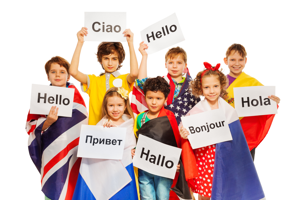 Kids holding greeting signs in different languages(Sergey Novikov)s