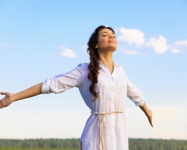 Young happy woman in green field, evening light(AXL)s