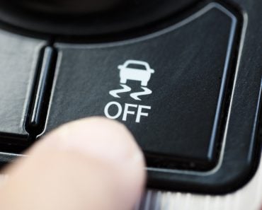 finger pressing Traction Control System button(Tom Wang)S