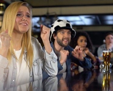 Anxious blond lady sports fan crossing fingers(Motortion Films)s