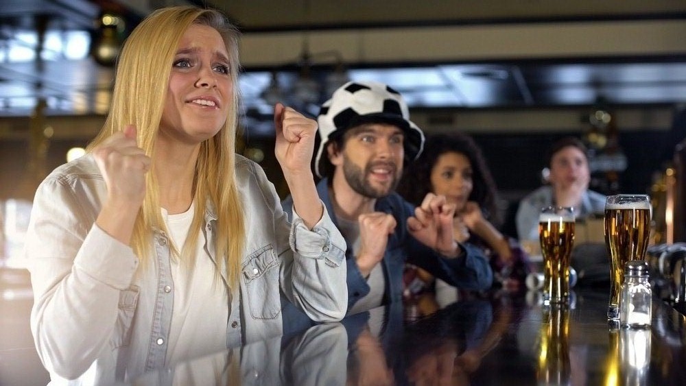 Anxious blond lady sports fan crossing fingers(Motortion Films)s