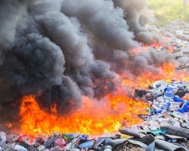 Burning garbage heap of smoke from a burning pile of garbage(SmerbyStudio)s