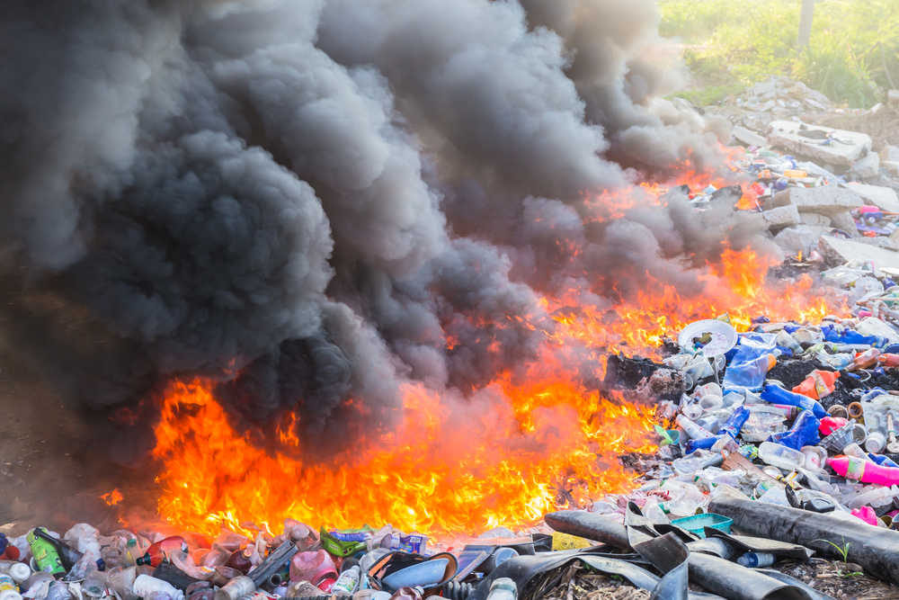 Burning garbage heap of smoke from a burning pile of garbage(SmerbyStudio)s