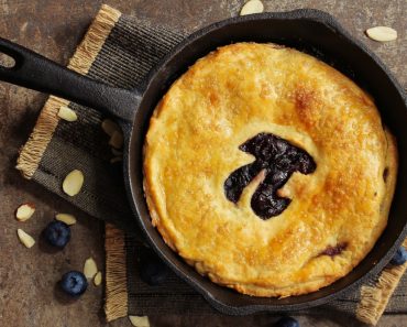 Pi Day special homemade blueberry pie baked in a skillet overhead view(vm2002)s