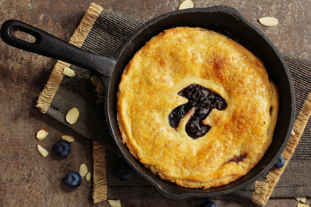 Pi Day special homemade blueberry pie baked in a skillet overhead view(vm2002)s