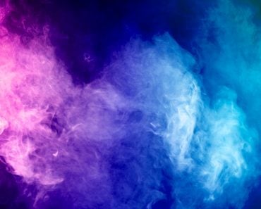 Blue, pink, purple vape smoke on black isolated background(Everyonephoto Studio)s