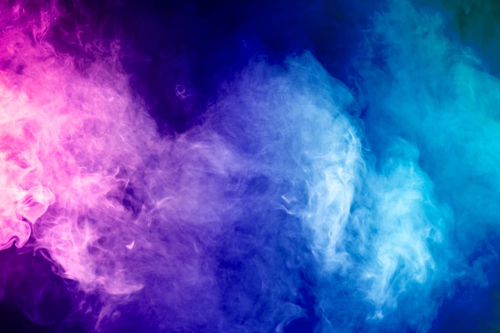 Blue, pink, purple vape smoke on black isolated background(Everyonephoto Studio)s