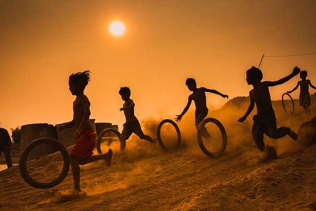 children playing with tire