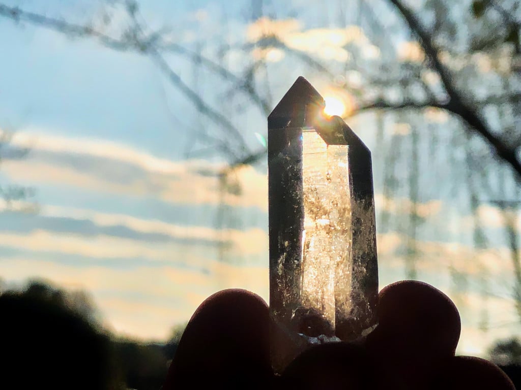 clear-quartz-point-takes-in-rays-from-the-sun_t20_roWalJ
