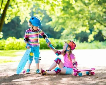 Children,Riding,Skateboard,In,Summer,Park.,Little,Girl,And,Boy