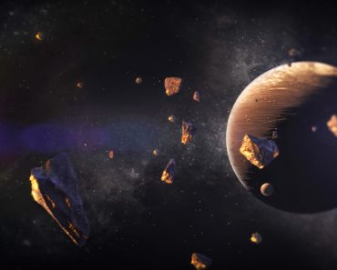 3d,Illustration,Of,Asteroids,With,Particles,Of,Gold,Suspended,Around