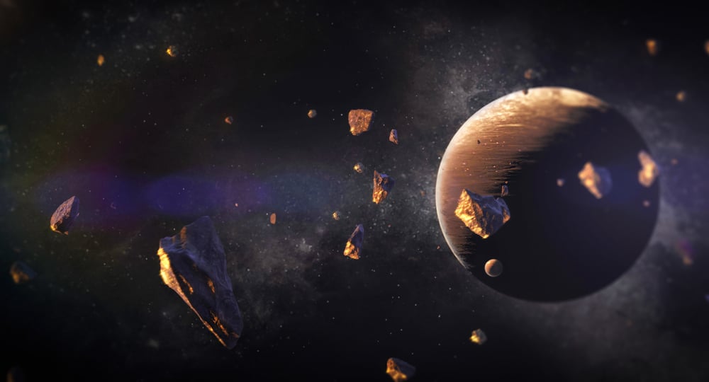 3d,Illustration,Of,Asteroids,With,Particles,Of,Gold,Suspended,Around