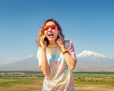 Woman,Is,Trying,To,Talk,On,Her,Mobile,Phone,,But