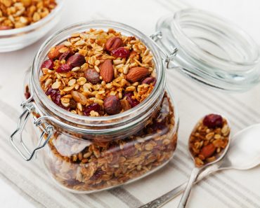 Homemade,Granola,In,Jar,On,White,Table,,Healthy,Breakfast,Of