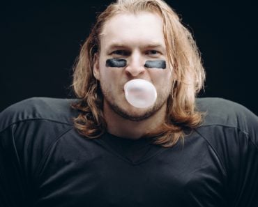 Face,And,Shoulder,Portrait,Of,Confident,American,Football,A,Prolific