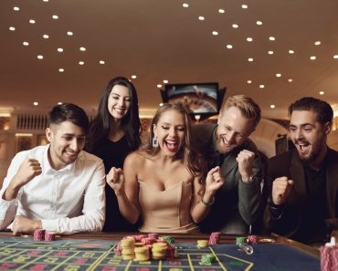 Happy,People,Are,Betting,In,Gambling,At,Roulette,Poker,In