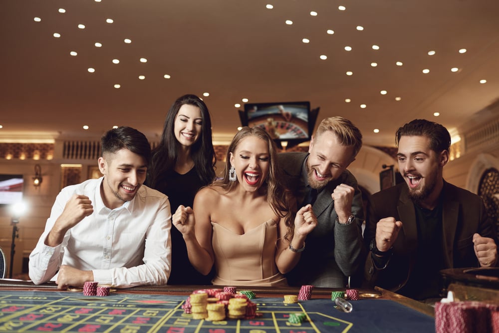 Happy,People,Are,Betting,In,Gambling,At,Roulette,Poker,In