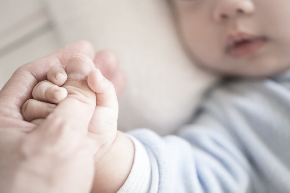 Little,Newborn,Baby,Holding,Parent's,One,Hand,,Close-up,Macro,Shot.