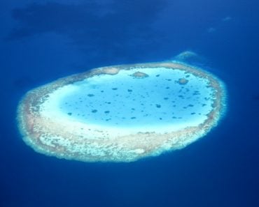 Aerial,View,Of,An,Atoll,In,The,Azure,Blue,South